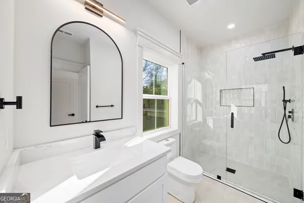 a view of room with wooden floor