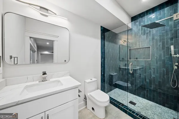 a kitchen with a sink and chandelier