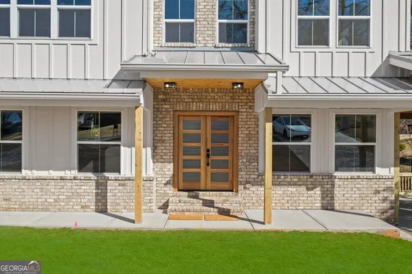 a front view of a house with a yard