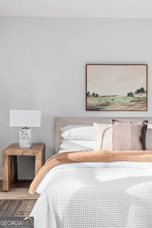 a front view of a building with retail shops and traffic signal