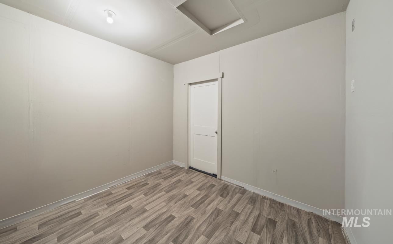 12443 Varga Street Caldwell, ID 83607 - Photo 20 of 27 Unfurnished room featuring attic access and light wood finished floors