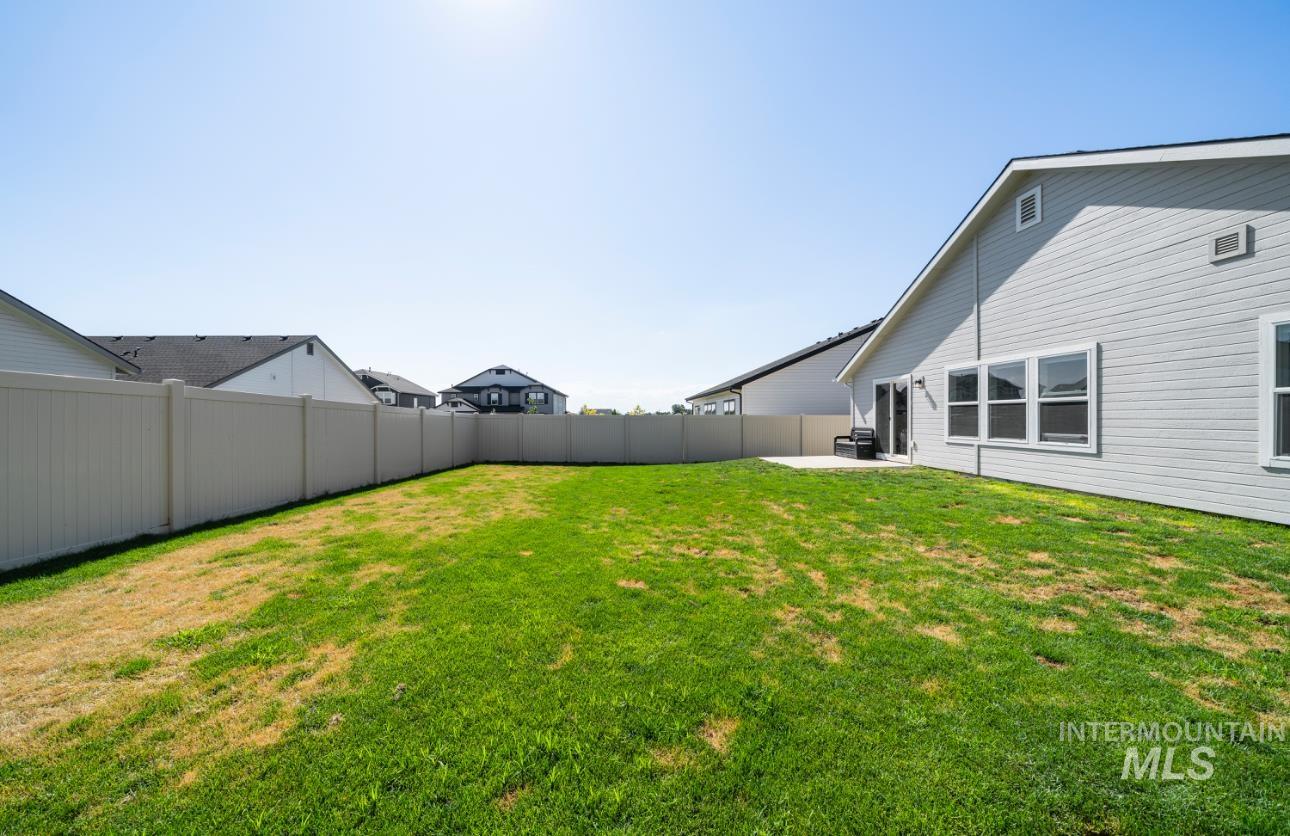 12443 Varga Street Caldwell, ID 83607 - Photo 27 of 27 View of yard featuring a patio
