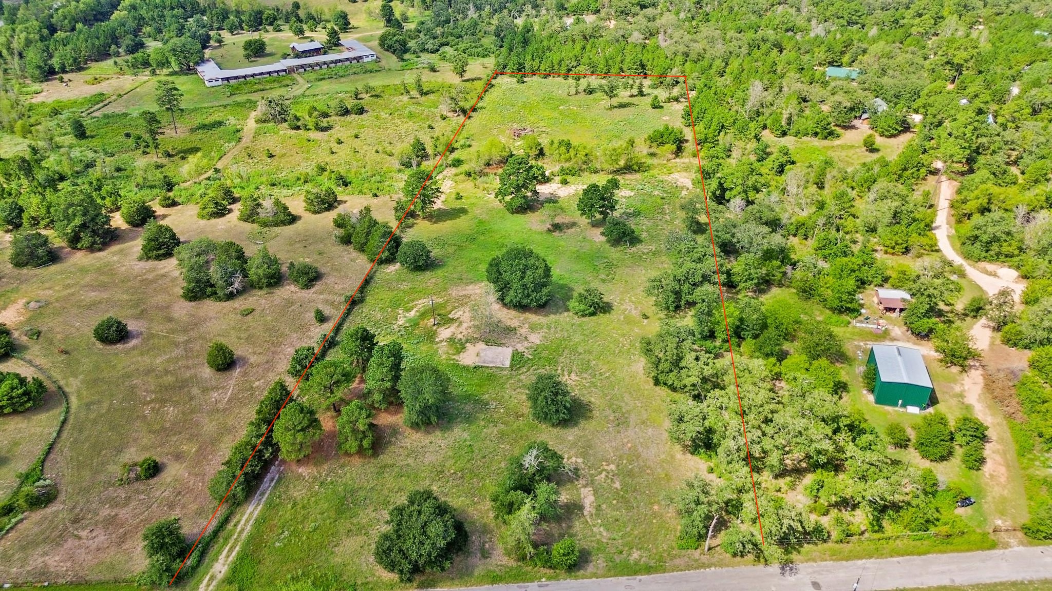 147 Pine Valley Drive Paige, TX 78659 - Photo 1 of 14 Aerial view of sparsely populated area featuring property boundaries highlighted