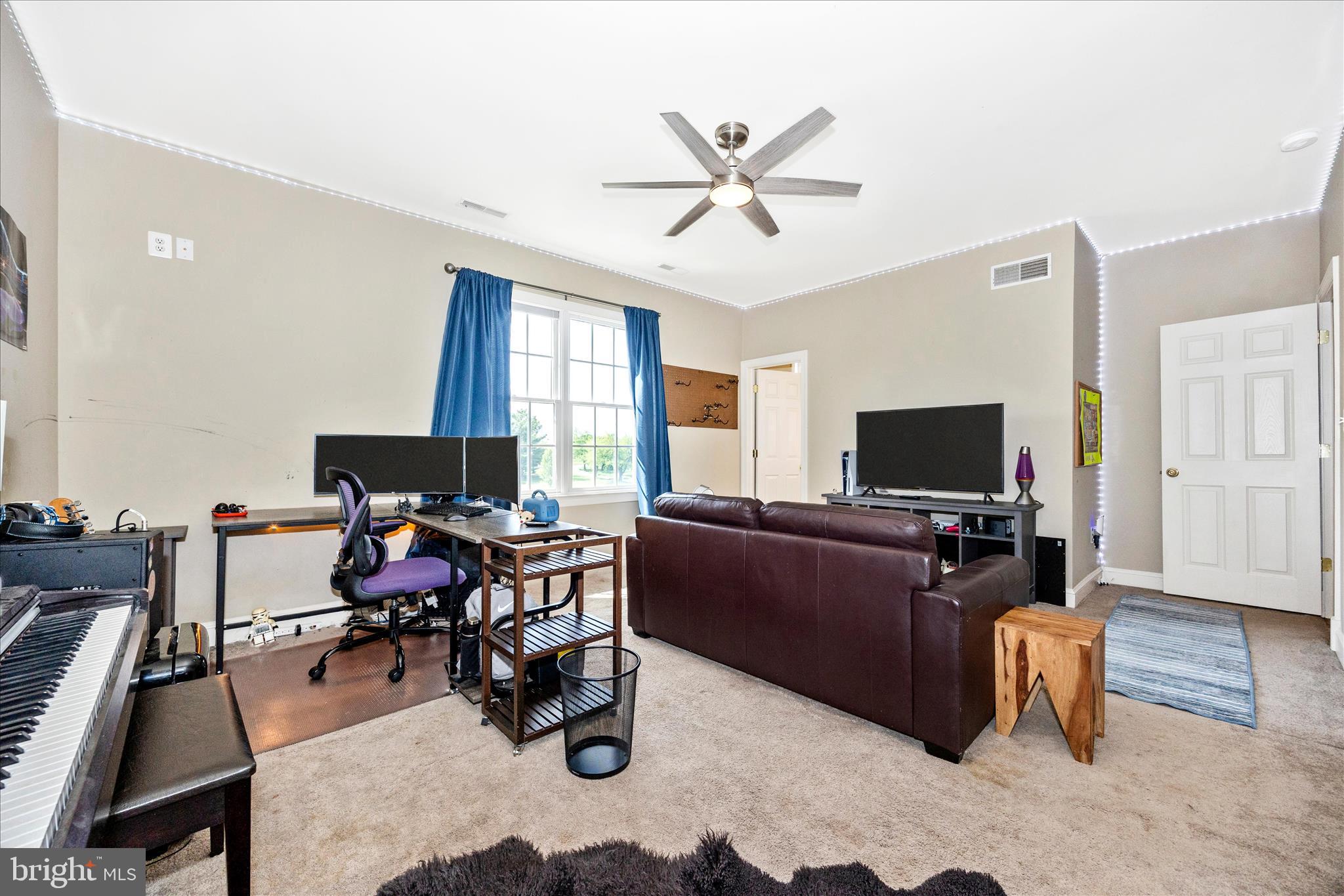 14746 New Windsor Road New Windsor, MD 21776 - Photo 34 of 67 a living room with furniture and a flat screen tv