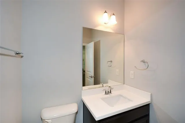 a view of a livingroom with a ceiling fan and window