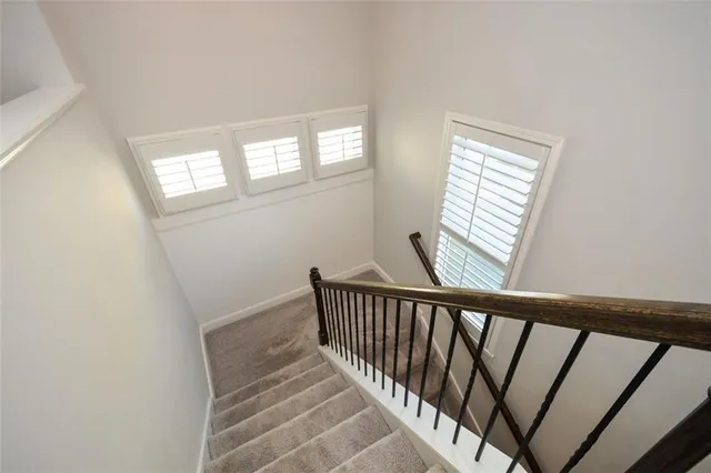a bathroom with a shower and a bath tub