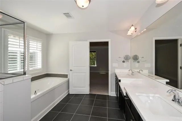 a view of a deck with wooden floor and outdoor seating