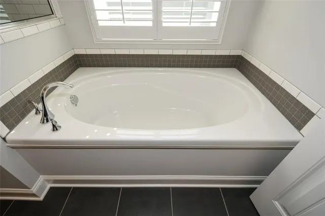 a view of a backyard with plants and a patio