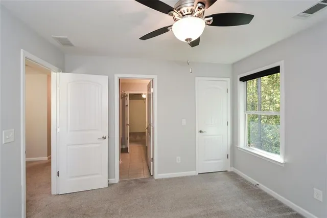 an aerial view of a house with garden space and street view