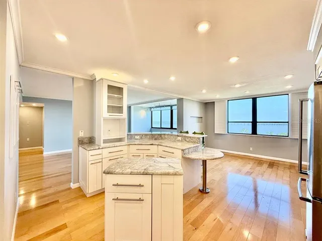 a kitchen with a sink cabinets and window