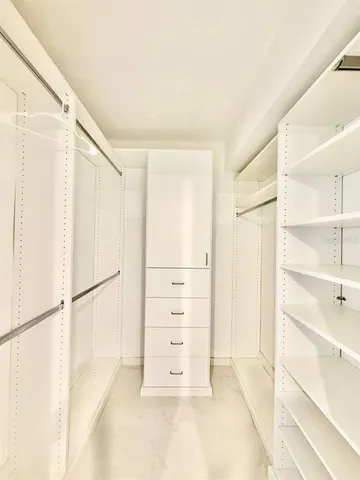 a bathroom with a shower and a bath tub