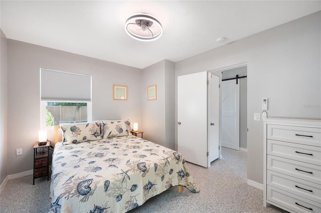 211 77th Street, Unit EAST Holmes Beach, FL 34217 - Photo 11 of 18 a bedroom with a bed and closet