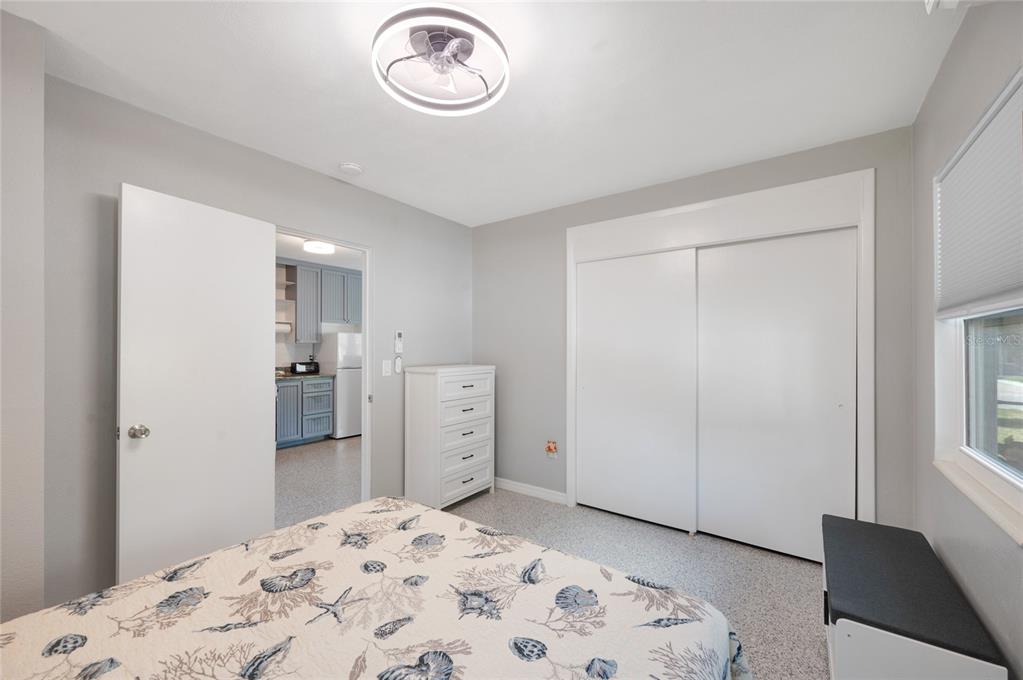 211 77th Street, Unit EAST Holmes Beach, FL 34217 - Photo 12 of 18 a bedroom with a bed and a closet