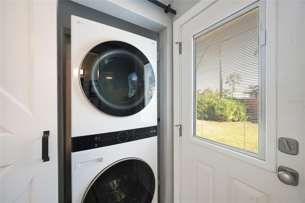 211 77th Street, Unit EAST Holmes Beach, FL 34217 - Photo 10 of 18 a close up view of a washer and dryer