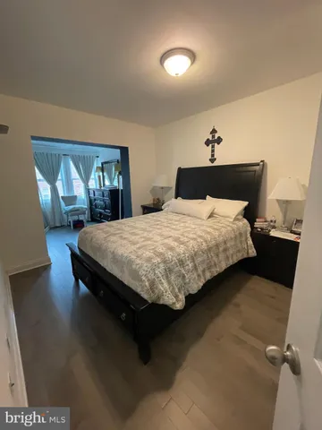 a bedroom with a bed and dresser