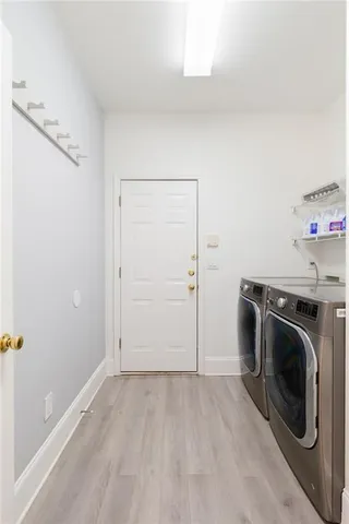 a bathroom with a granite countertop sink a toilet and shower