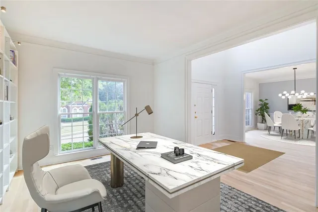 a living room with furniture a flat screen tv and a floor to ceiling window
