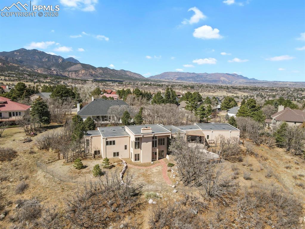 Aerial View of the back of this spacious contemporary ranch home with a full walk-out lower level.