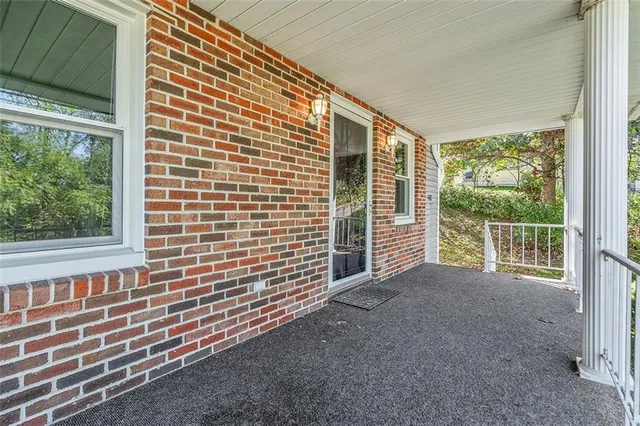 a view of a porch with a bench