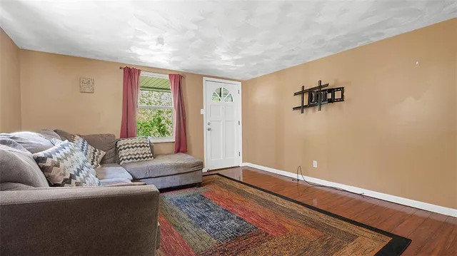 a living room with furniture and a rug
