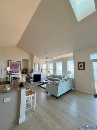 a living room with furniture window and a wooden floor