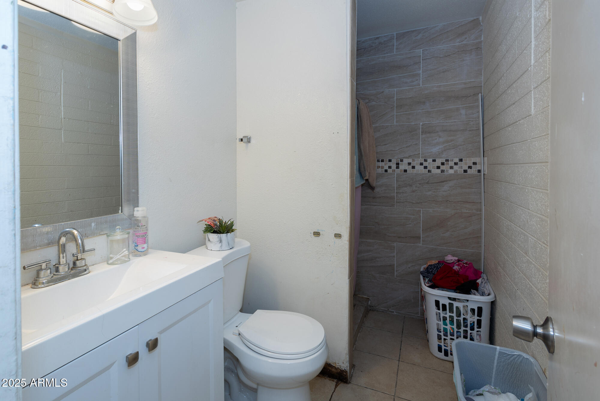 6826 South 8th Street Phoenix, AZ 85042 - Photo 11 of 22 a bathroom with a sink and a toilet