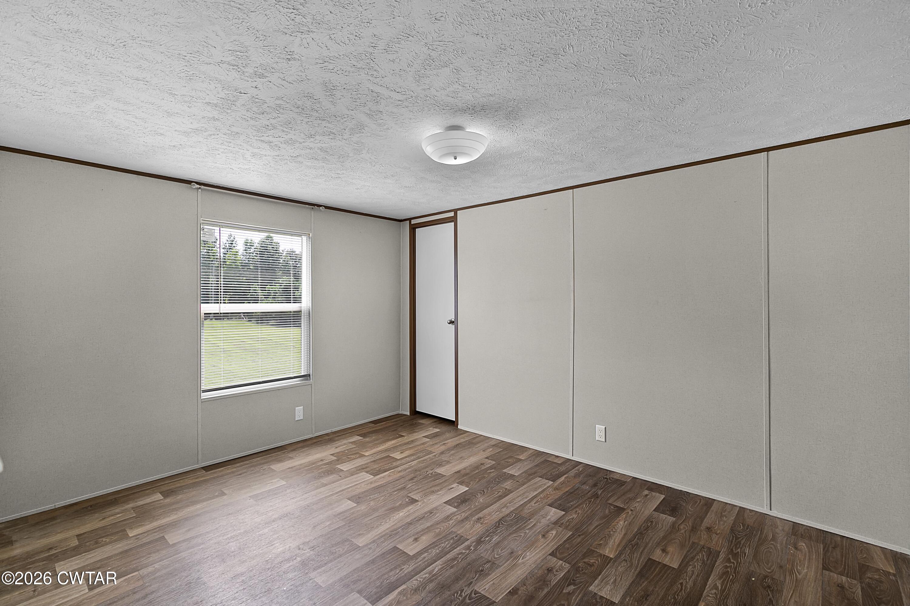 141 Persimmon Grove Road Trenton, TN 38382 - Photo 15 of 20 an empty room with windows