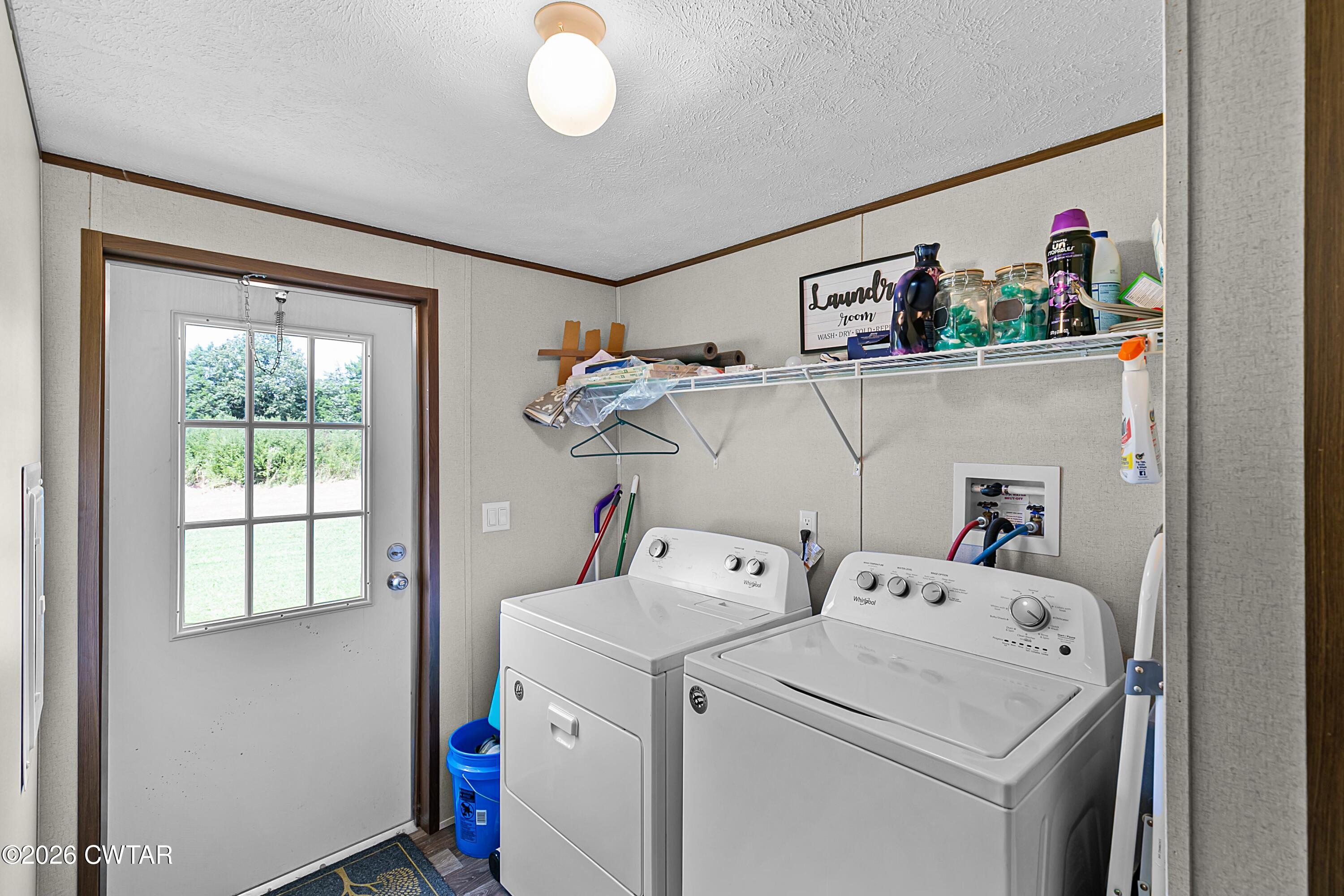 141 Persimmon Grove Road Trenton, TN 38382 - Photo 16 of 20 a utility room with dryer and washer