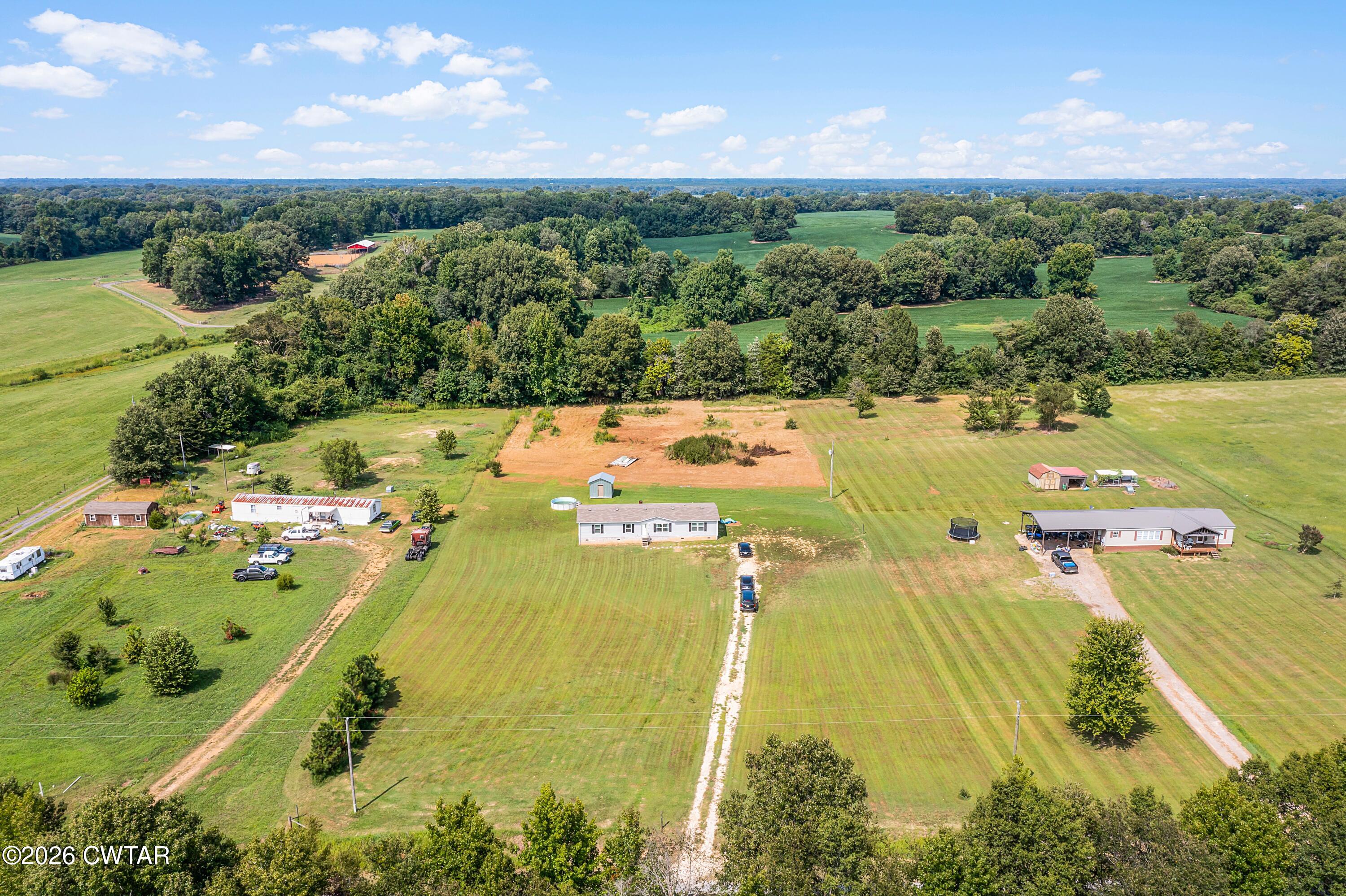 141 Persimmon Grove Road Trenton, TN 38382 - Photo 19 of 20 an aerial view of residential houses with outdoor space and a lake view