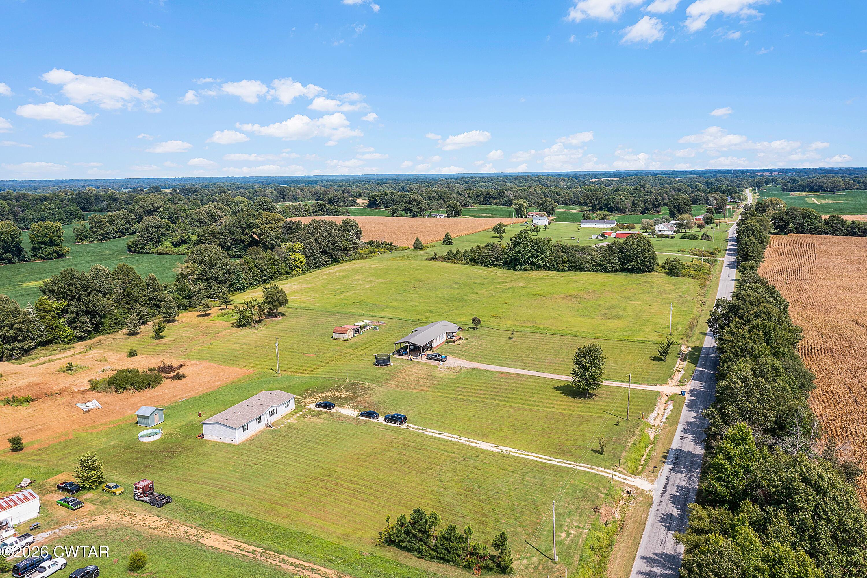 141 Persimmon Grove Road Trenton, TN 38382 - Photo 20 of 20 a view of a lake with a city
