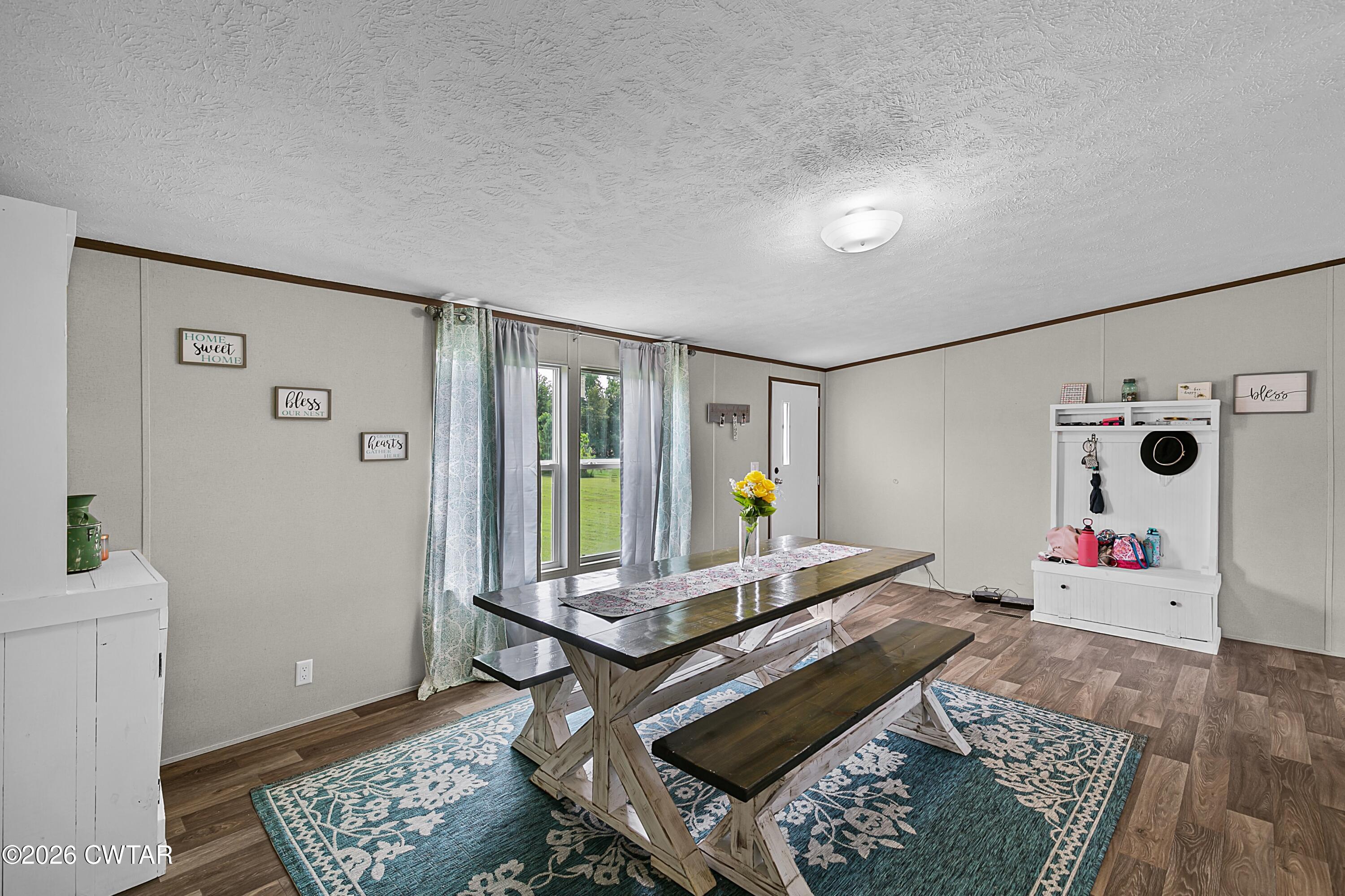 141 Persimmon Grove Road Trenton, TN 38382 - Photo 6 of 20 a living room with furniture and wooden floor