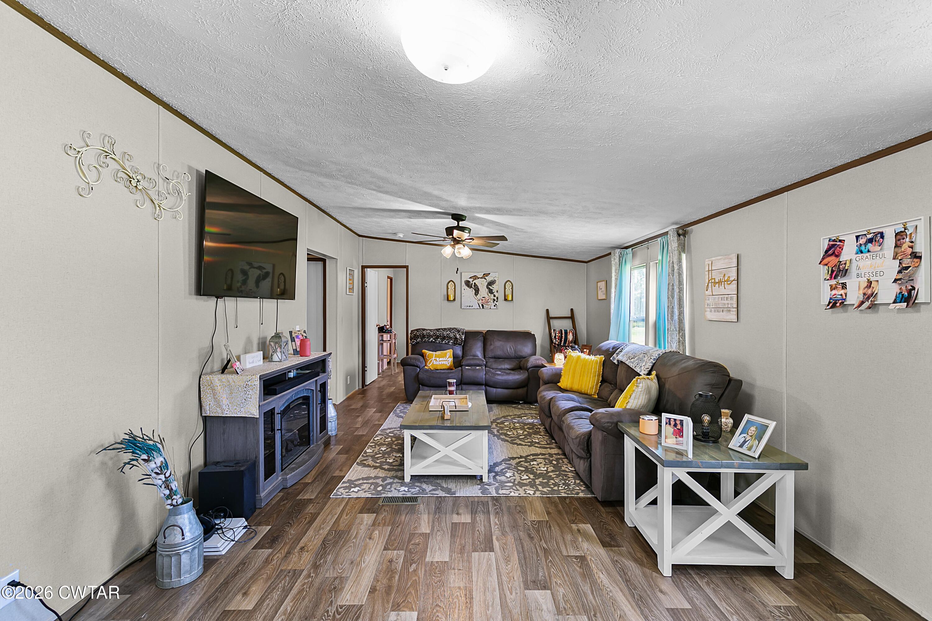 141 Persimmon Grove Road Trenton, TN 38382 - Photo 10 of 20 a living room with furniture and a flat screen tv