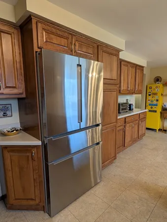 a kitchen with stainless steel appliances a refrigerator and a sink