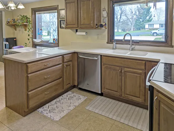 a kitchen with a sink stove and cabinets