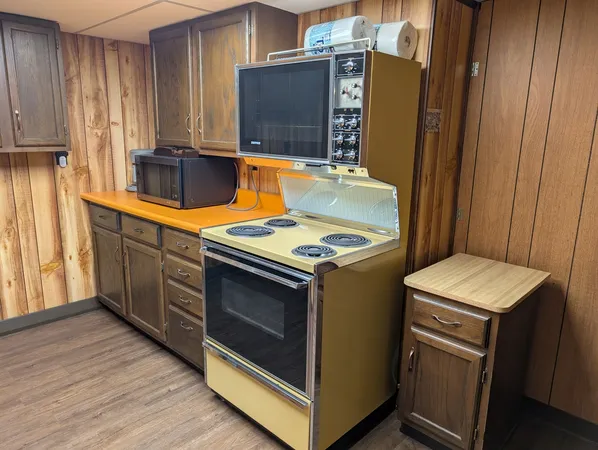 a kitchen with a stove and a microwave