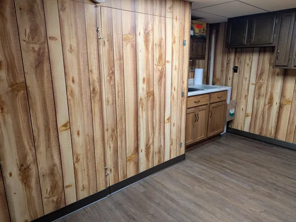 a kitchen with stainless steel appliances a refrigerator and cabinets