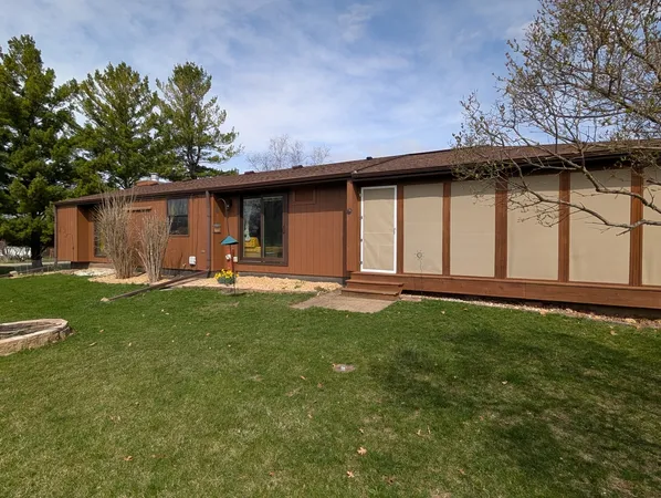 a backyard of a house with lots of green space