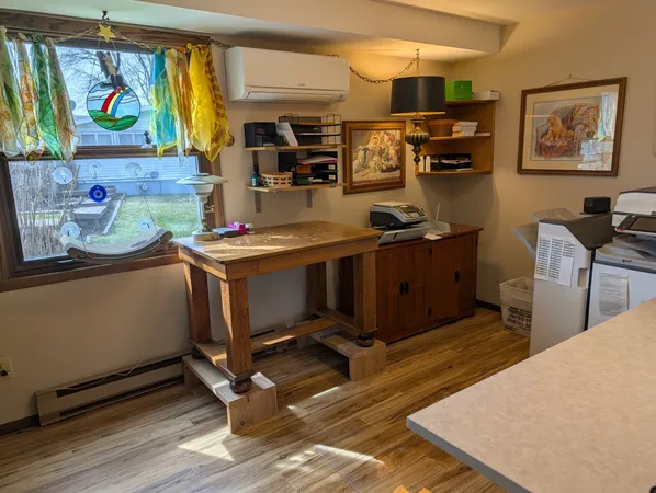 a view of a workspace with furniture and toys