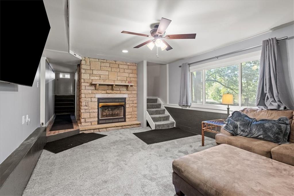 521 Benjamin Street Tarentum, PA 15084 - Photo 13 of 19 a living room with furniture a fireplace and a flat screen tv