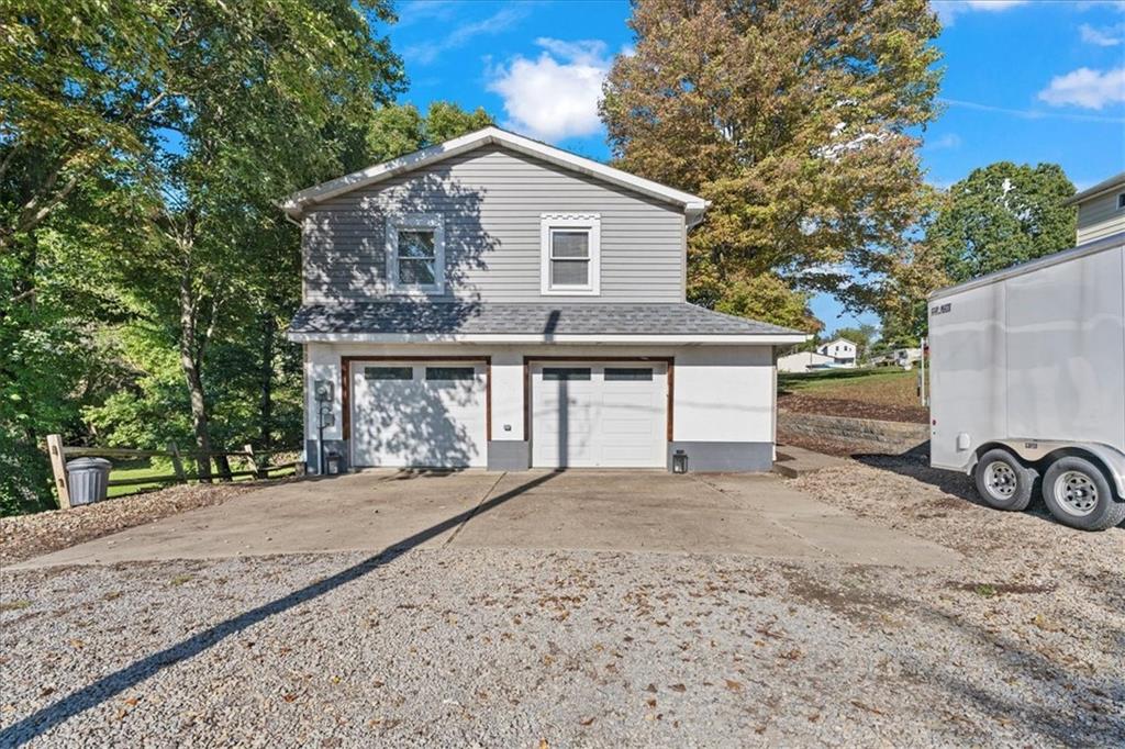 521 Benjamin Street Tarentum, PA 15084 - Photo 16 of 19 a front view of a house with parking area