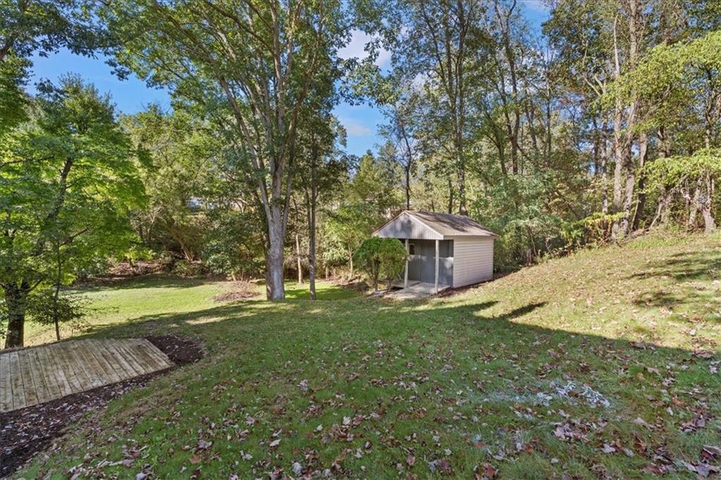 521 Benjamin Street Tarentum, PA 15084 - Photo 18 of 19 a view of a house with a yard and large trees
