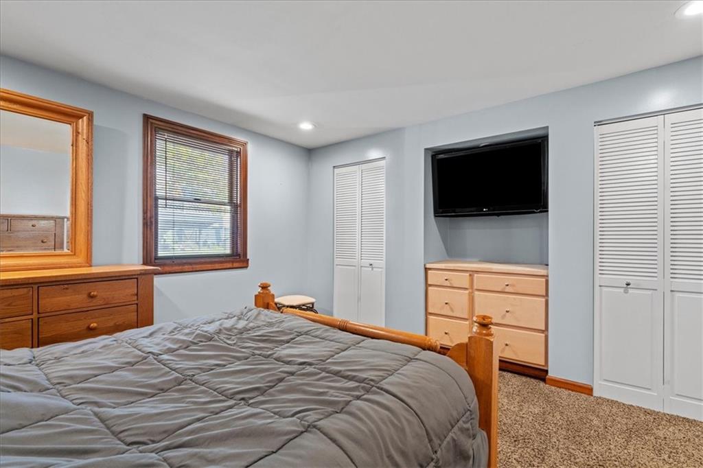 521 Benjamin Street Tarentum, PA 15084 - Photo 7 of 19 a bedroom with a bed and a flat screen tv