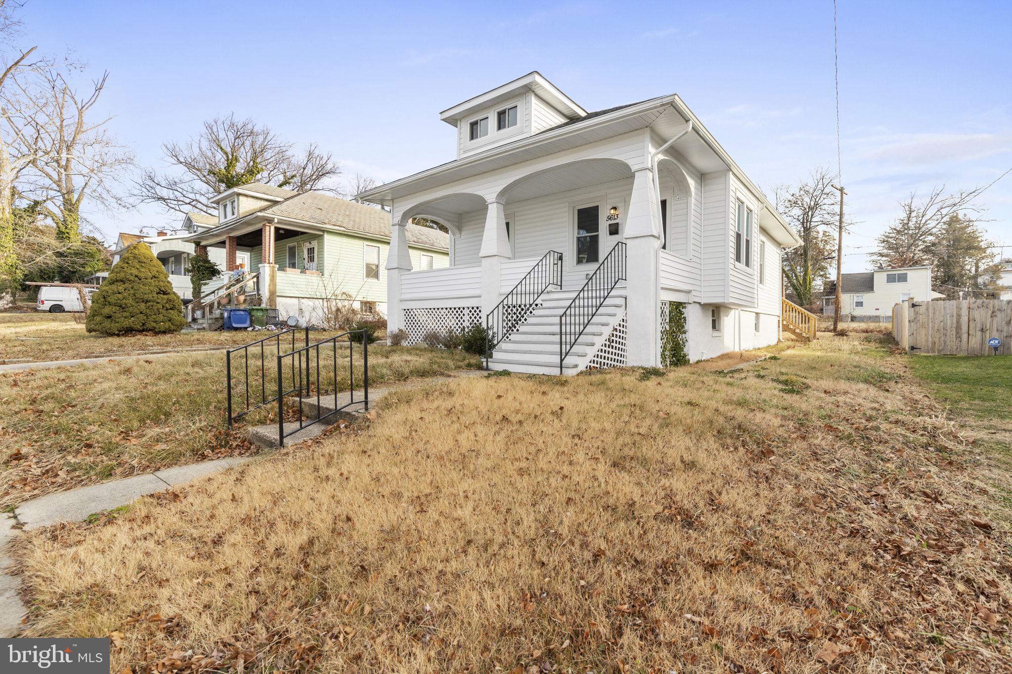 5613 Plymouth Road Baltimore, MD 21214 - Photo 26 of 31 a front view of a house with a yard