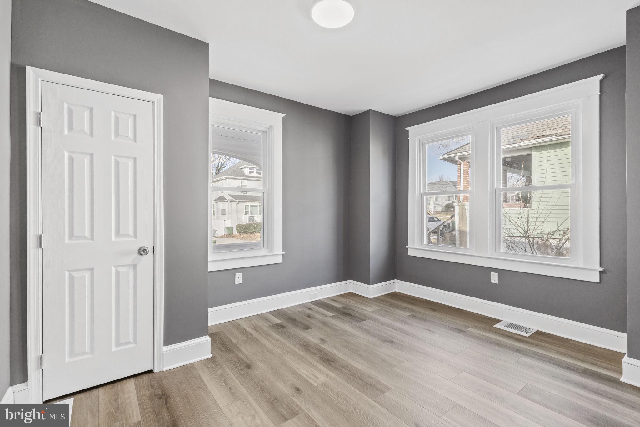 5613 Plymouth Road Baltimore, MD 21214 - Photo 8 of 31 a view of wooden floor and windows in a room