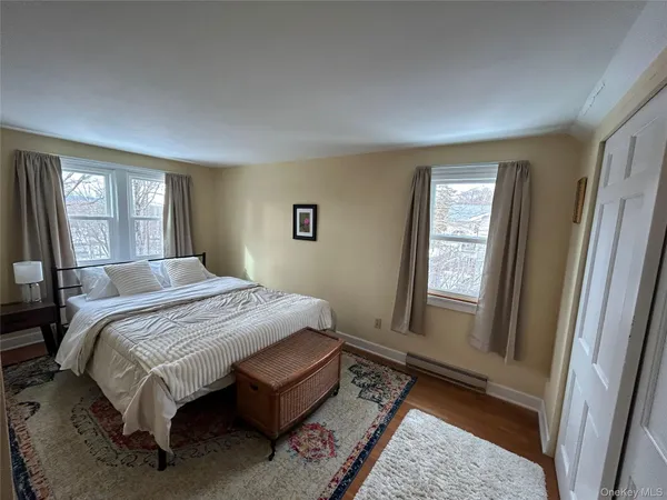 a room with a chair and a dresser