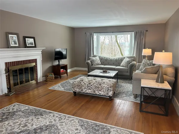 a living room with furniture rug and window