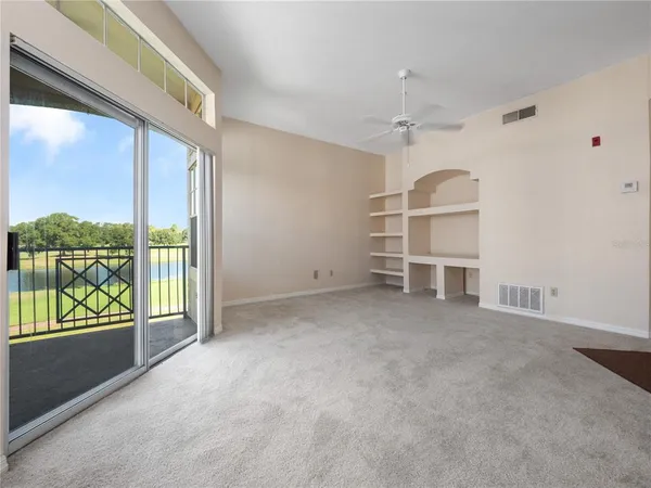 an empty room with windows and view