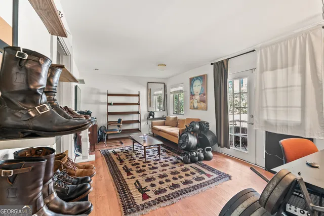 a bedroom with furniture and a window