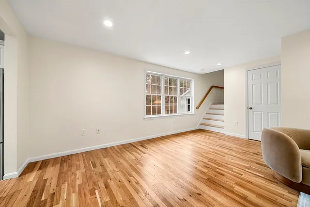a bedroom with bed and window
