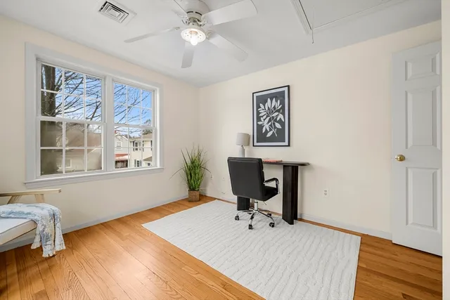 a work room with furniture and windows